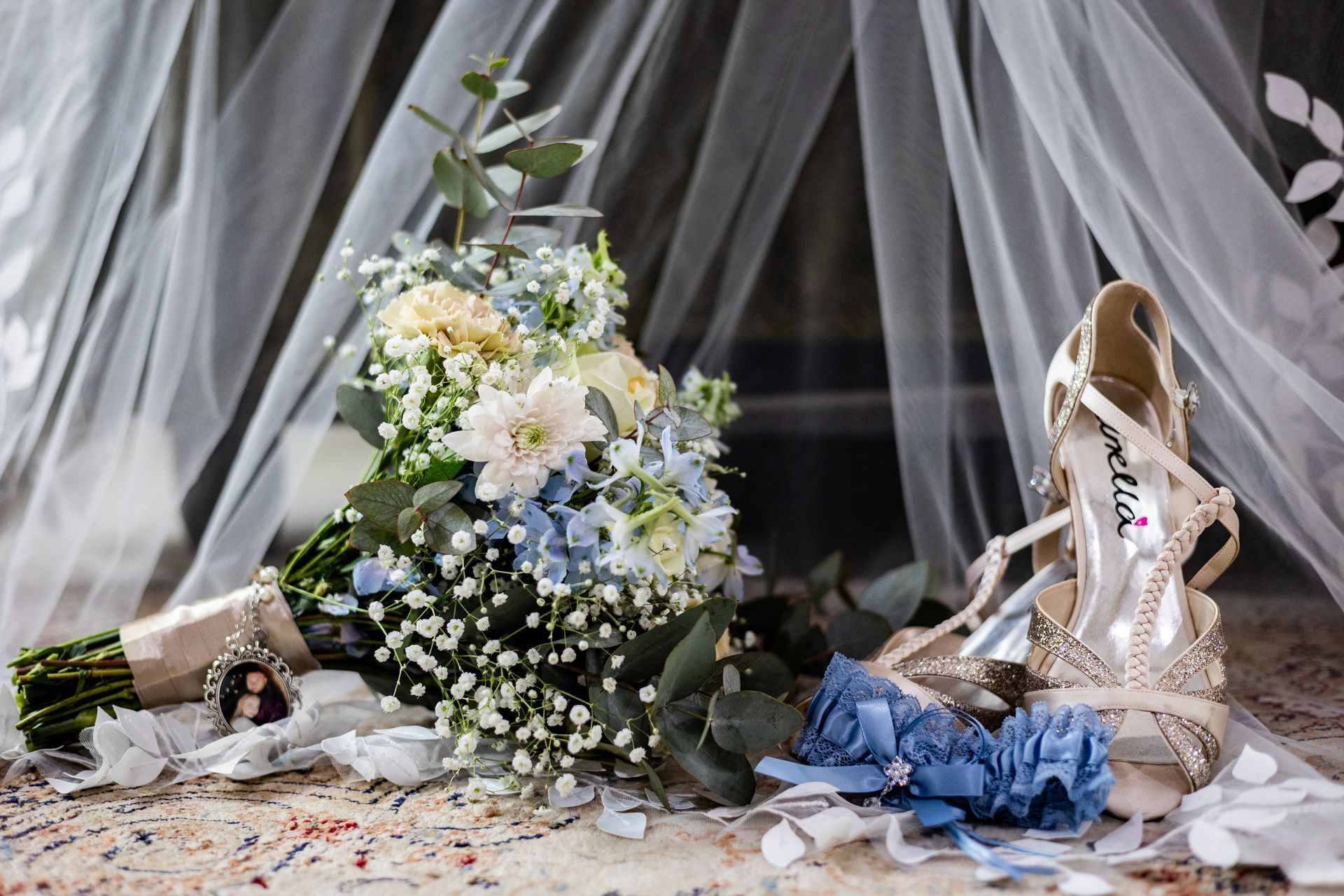 Image of flower bouquet and shoes of the bride at Riverside Castle Wedding venue.