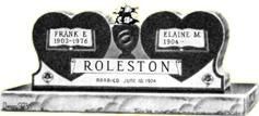 Rolston gravestone with two heart-shaped plaques, one for Frank and one for Eileen Mc, in black and white
