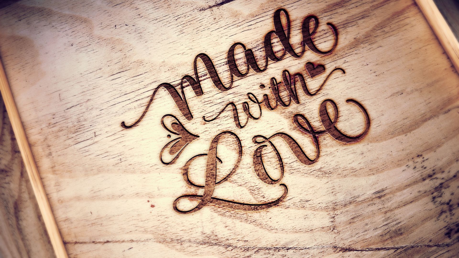 Wooden box with engrave words.