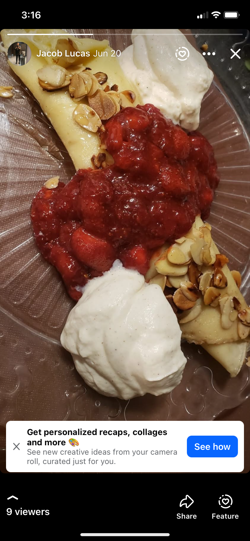 Crepe topped with strawberry sauce, banana slices, and whipped cream on a plate