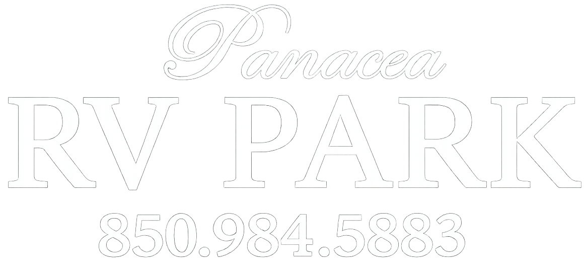 White RV Park sign with a phone number: 850.984.5888