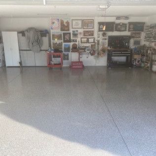 A garage filled with lots of furniture and pictures on the walls.