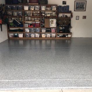 A garage filled with lots of shelves and bins.