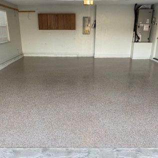 A garage with a concrete floor and white walls.