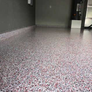 A garage floor with a lot of small stones on it.