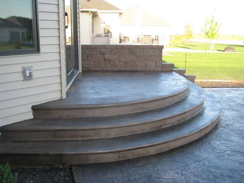 A set of concrete steps leading up to a house