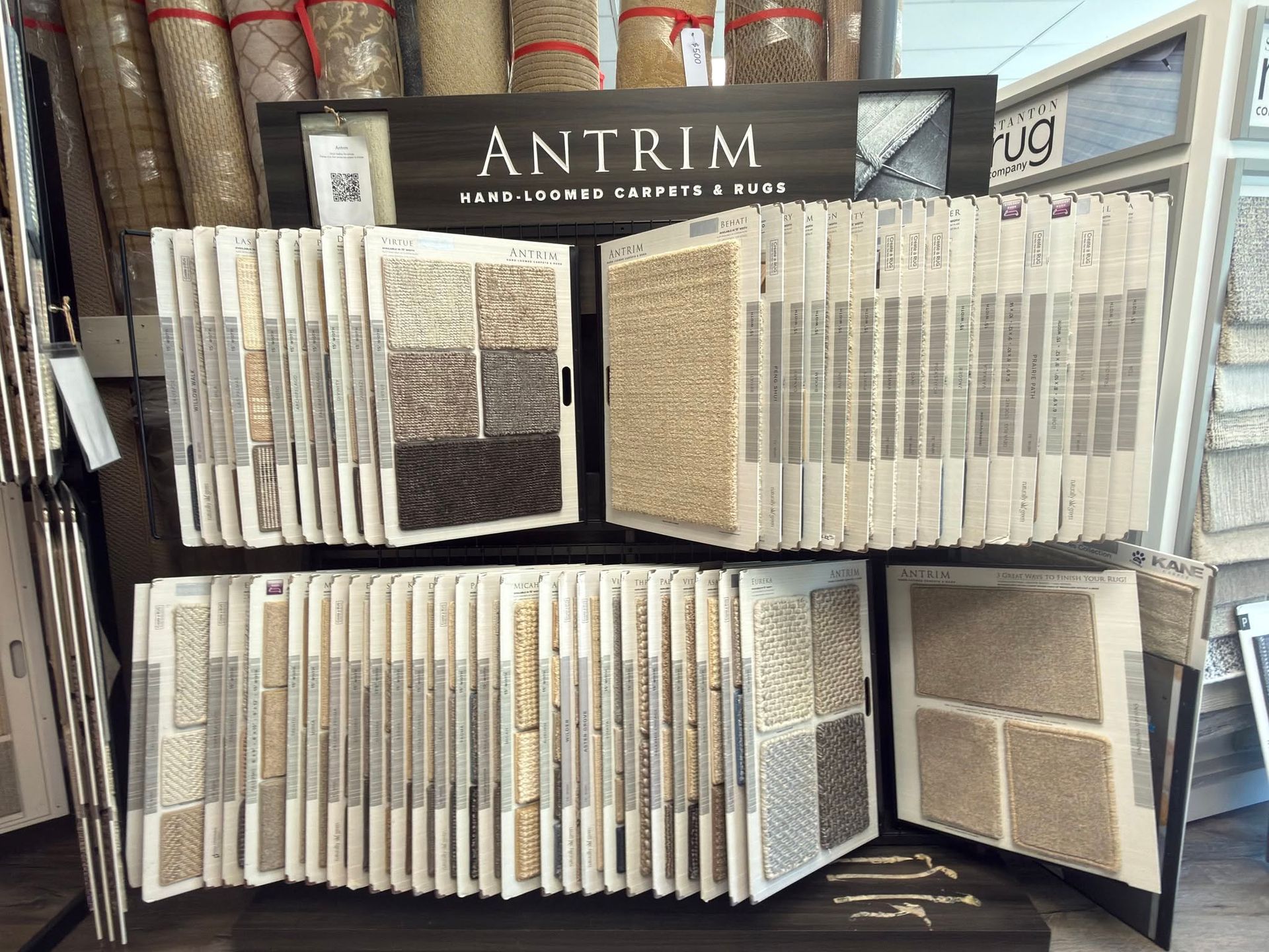 Open book display with pages fanned out, featuring the title “ANTRIM” at the top.