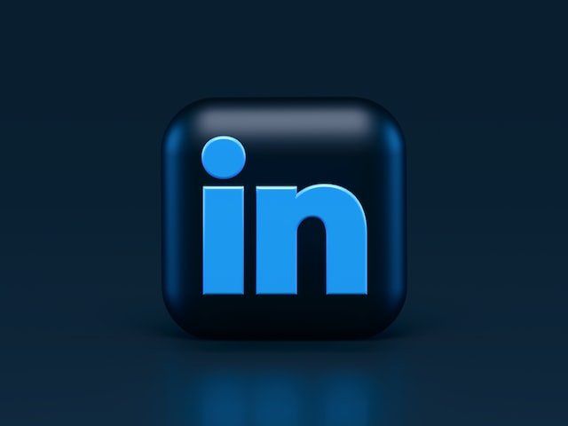 A blue and black linkedin logo on a dark blue background