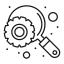A magnifying glass is looking at a gear on a black background.