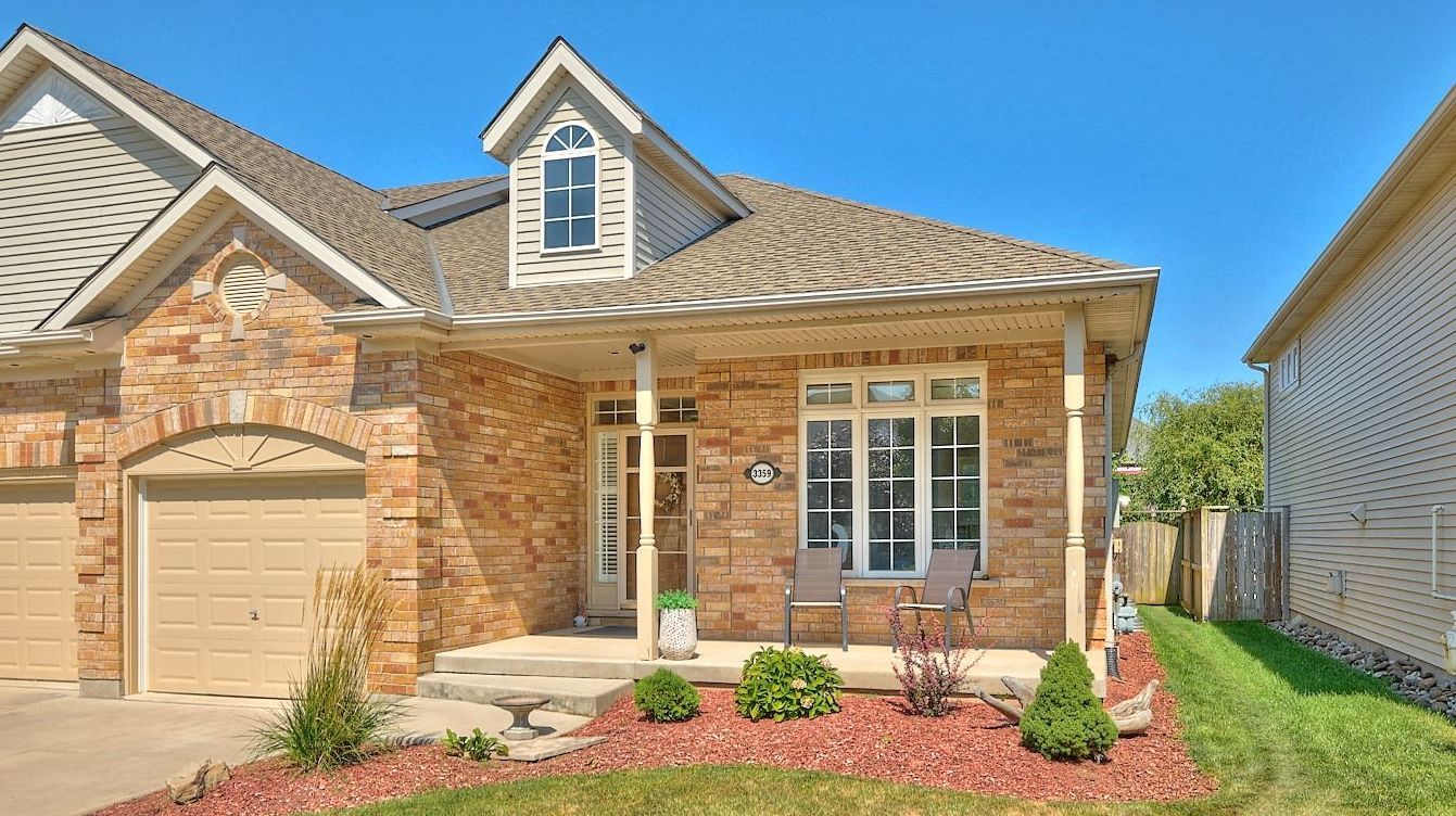 An orange brick end-unit bungalow located in Vineland, Ontario, Canada.