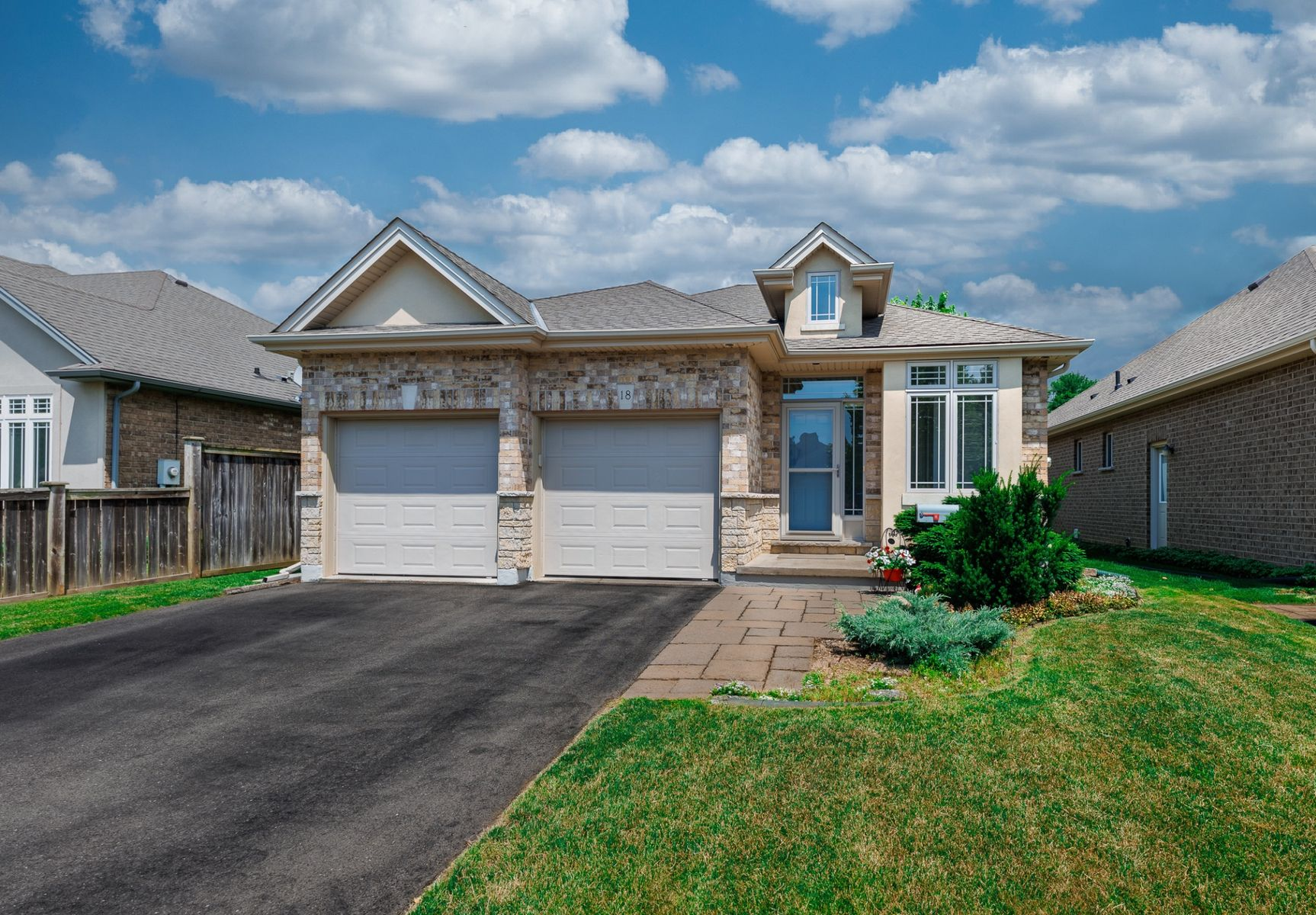 A bungalow home with an attached two-car garage.