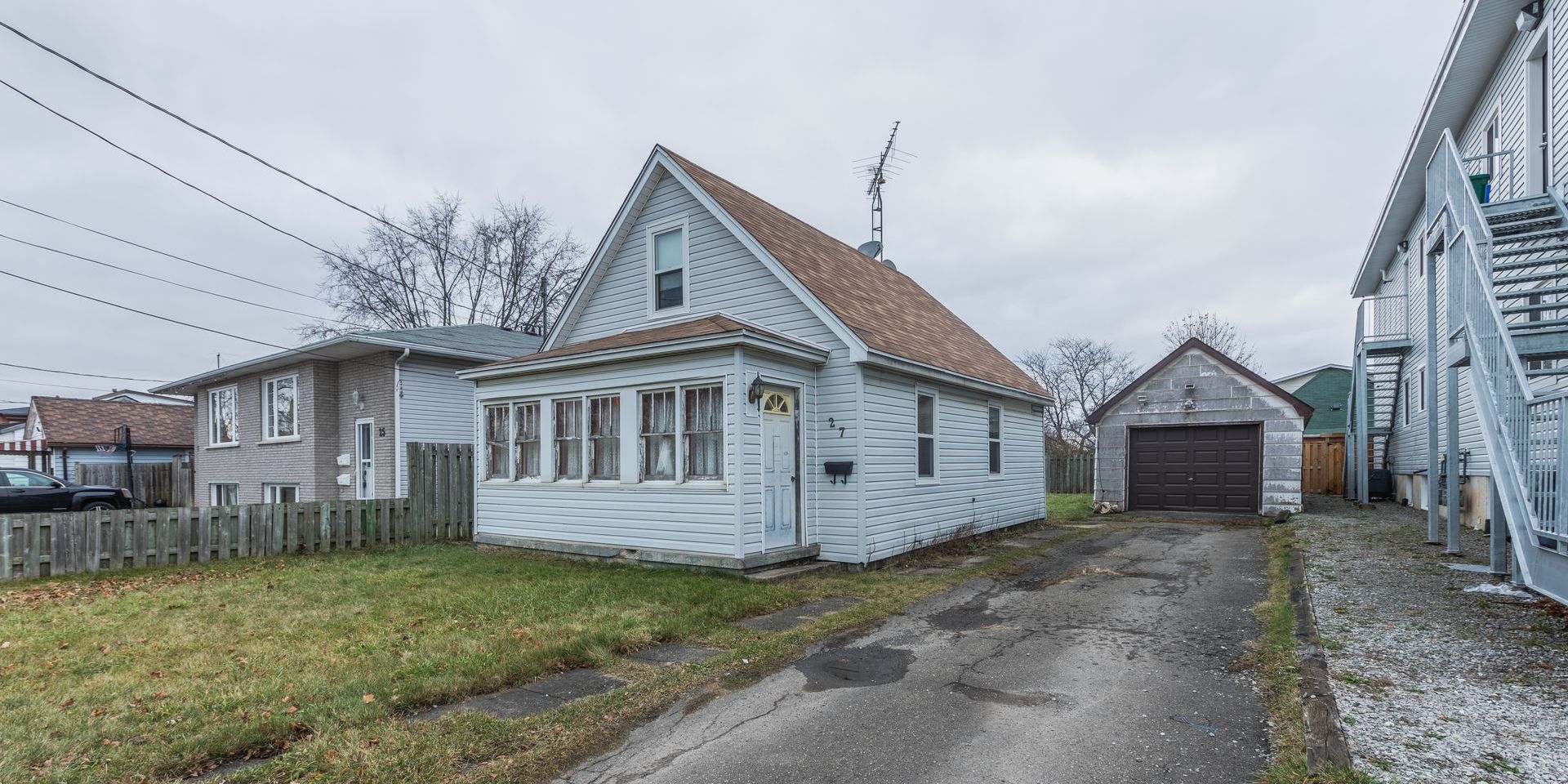 A detached home with a detached garage located in Welland, Ontario.