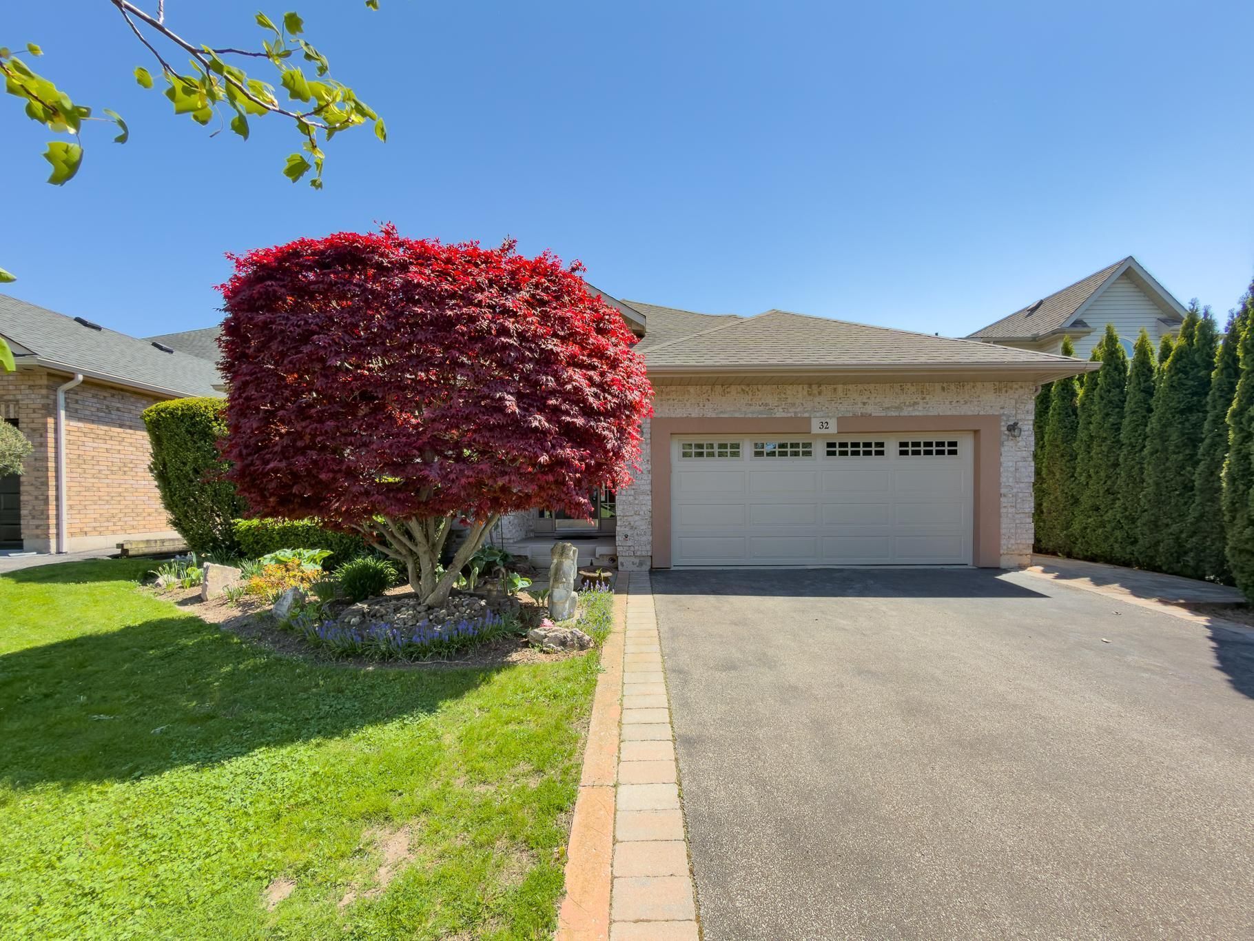 A bungalow home with an attached double-car garage.