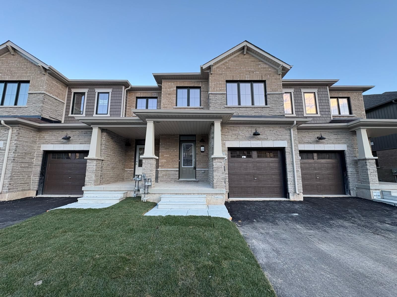 A stone and brick two-storey townhouse in Welland.