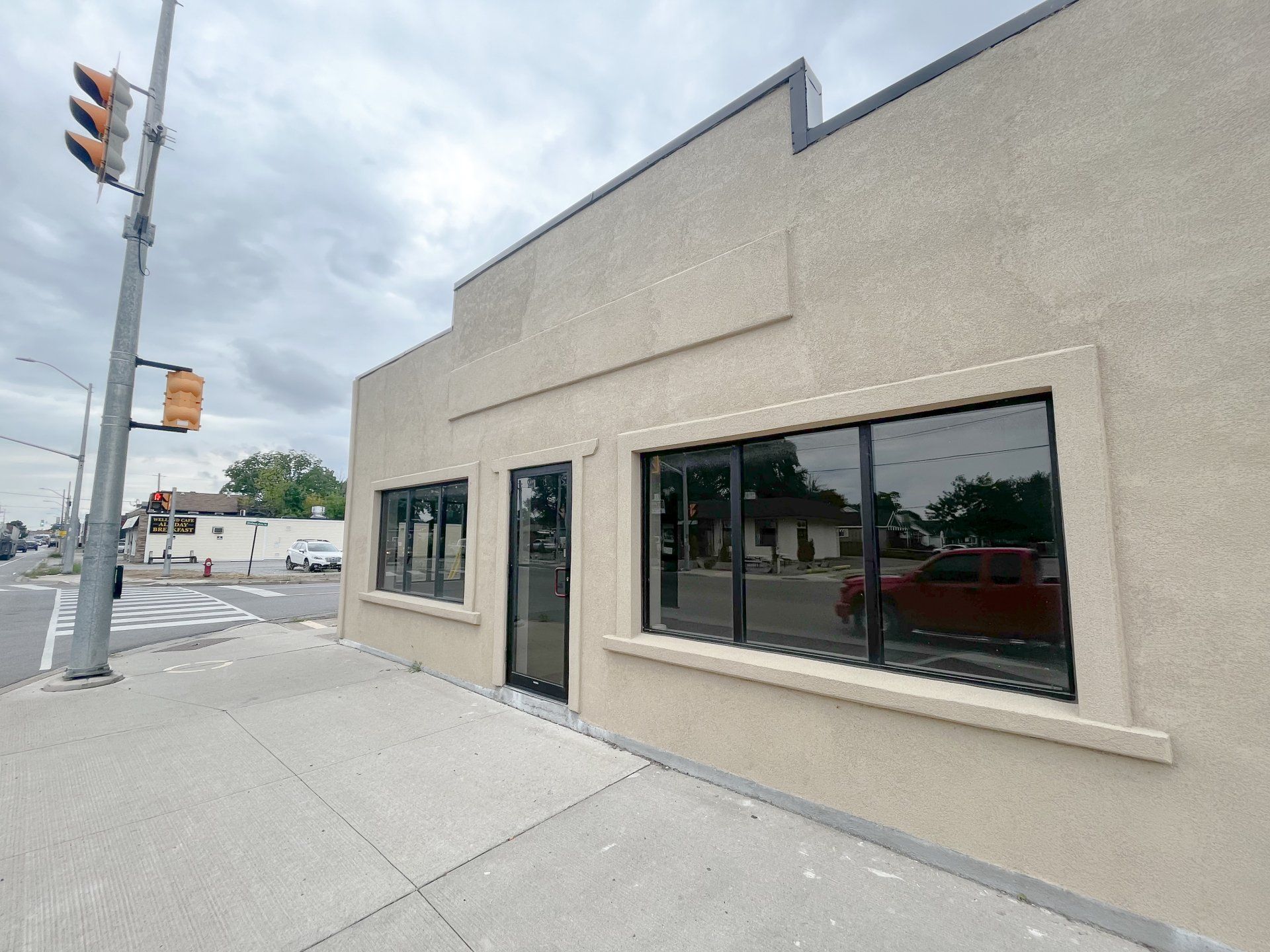 A picture of a prominent commercial business building on bustling Main Street.