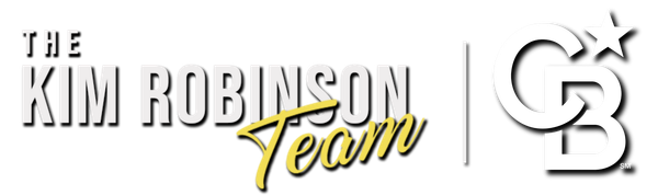 The Kim Robinson Team's real estate logo is in bold and italic yellow and white text.