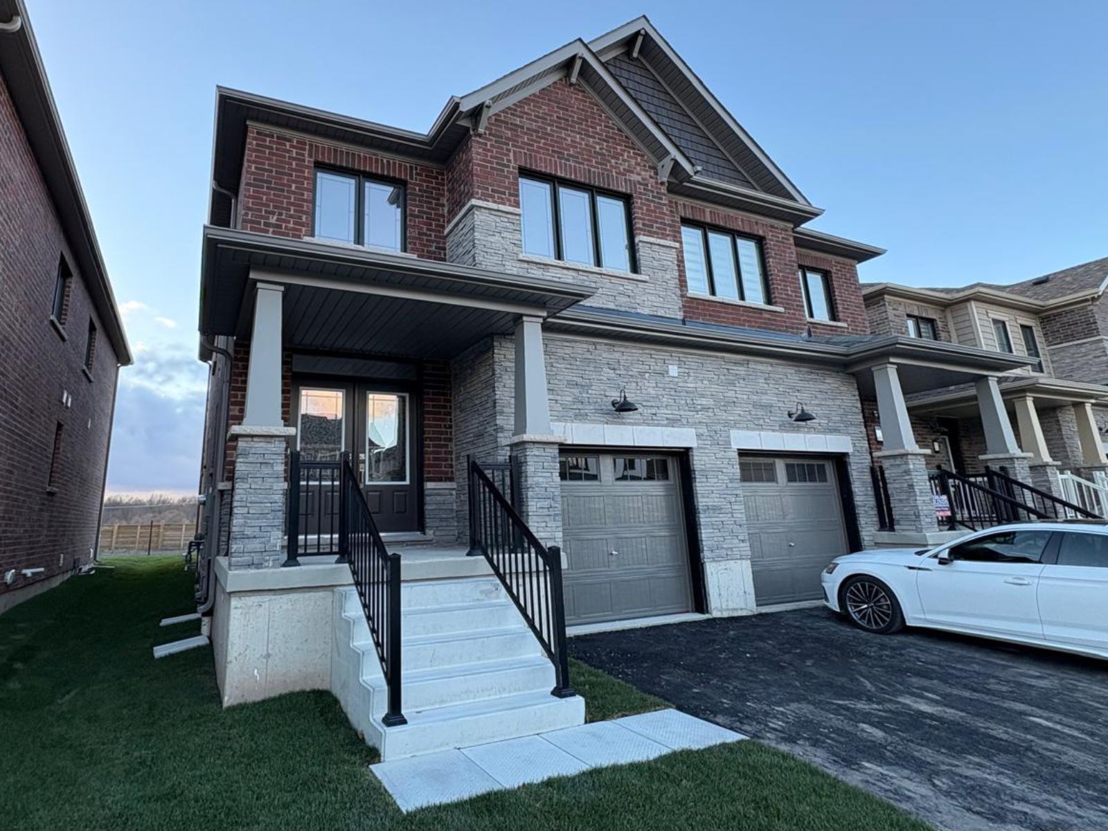 A two-storey brick and stone semi-detached home in Welland.