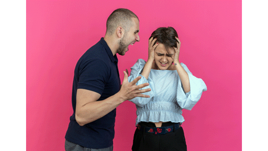 Man yelling at woman covering ears, pink background.