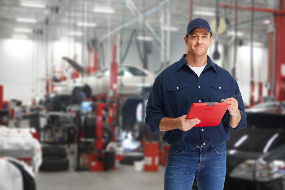 Car Mechanic Smiling — East Coast Mechanic in Nambucca Heads, NSW