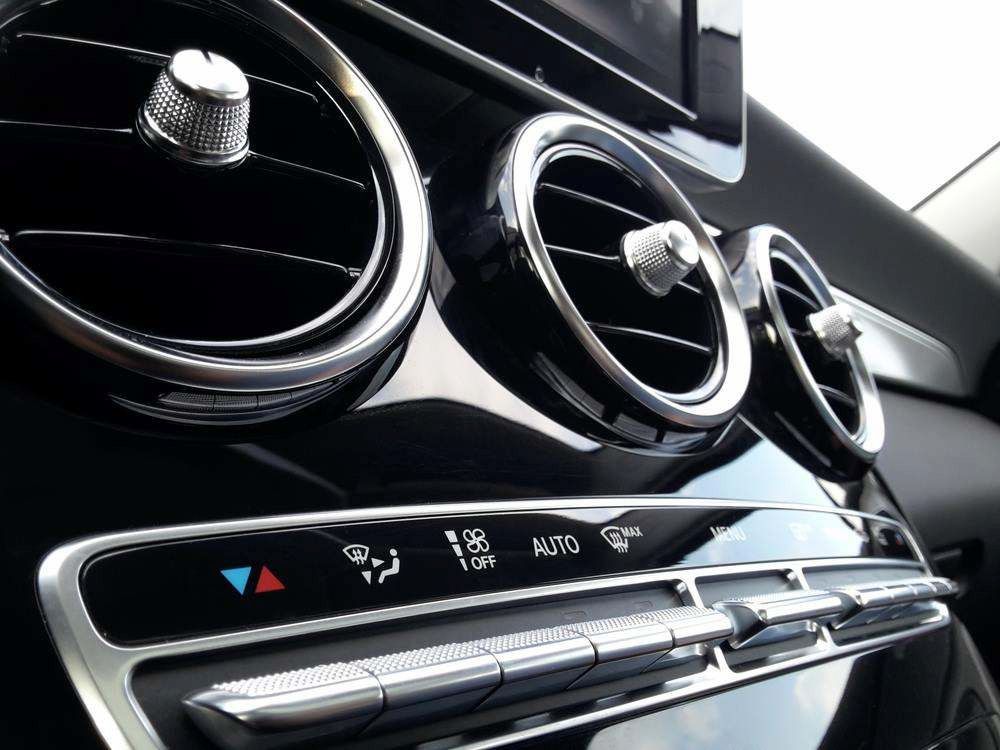 Car Dashboard with Chrome Air Vents and Climate Controls in A Black Interior — East Coast Mechanic in Urunga, NSW