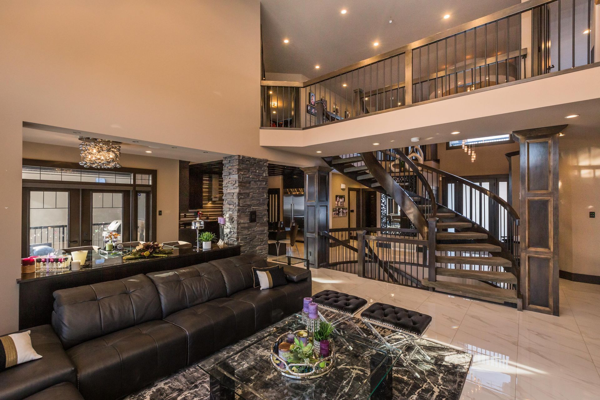 There is a spiral staircase in the middle of the living room.