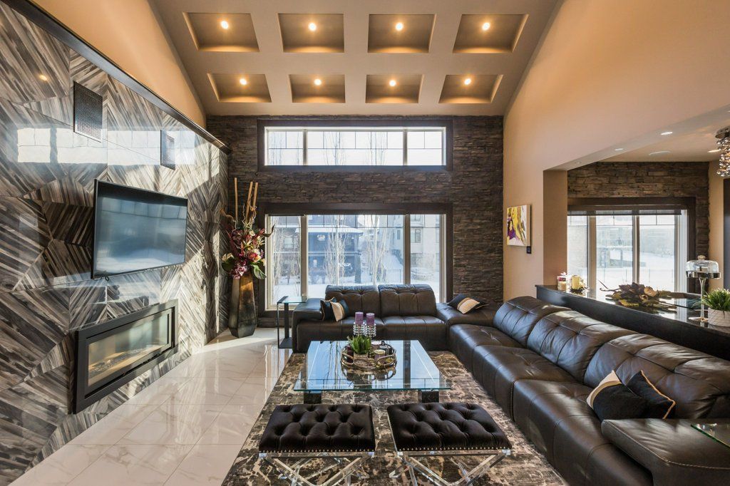 A living room with a lot of furniture and a flat screen tv.