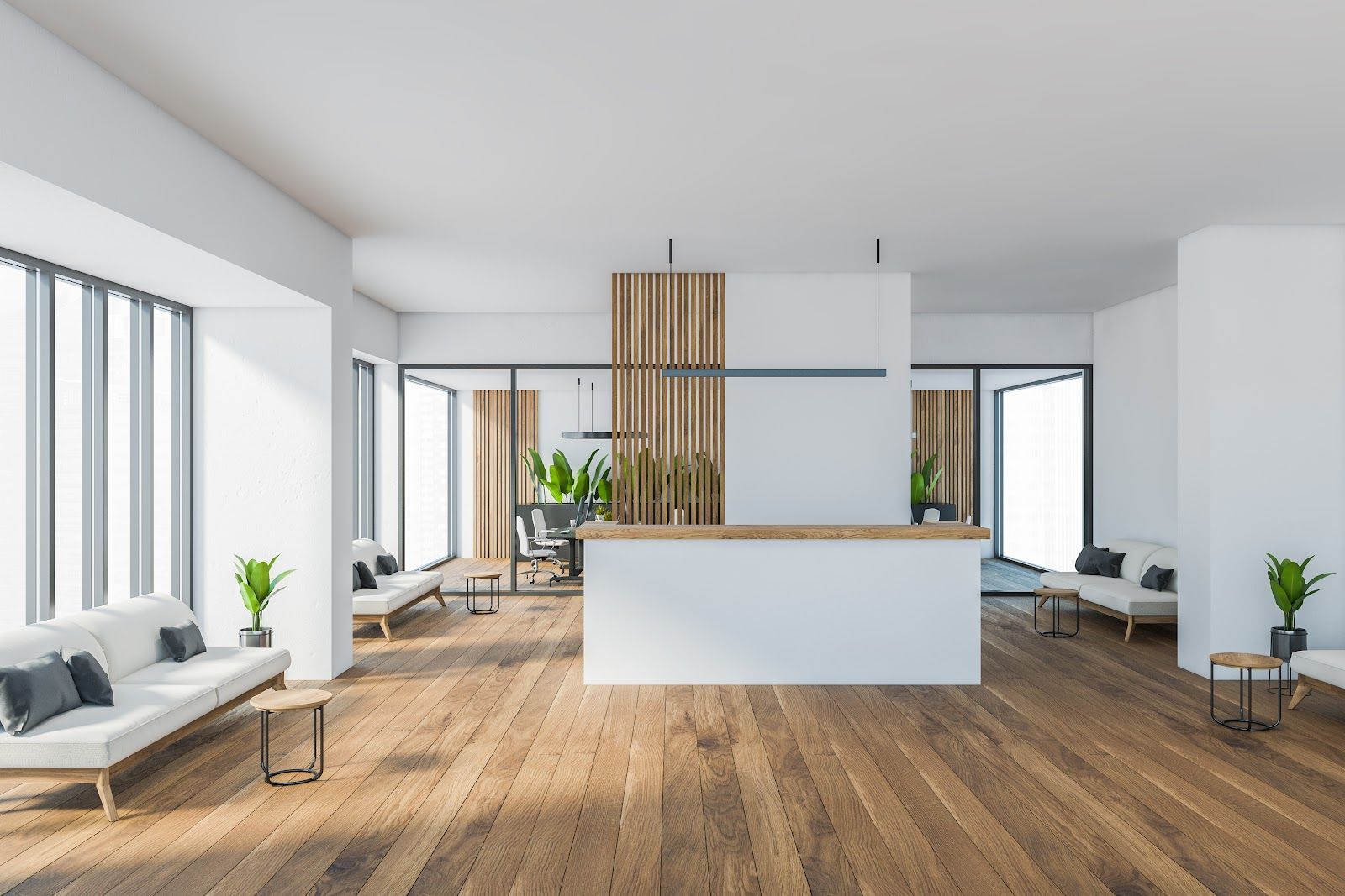 Modern minimalist living room with white walls, wood floors, large windows, and a central white island.