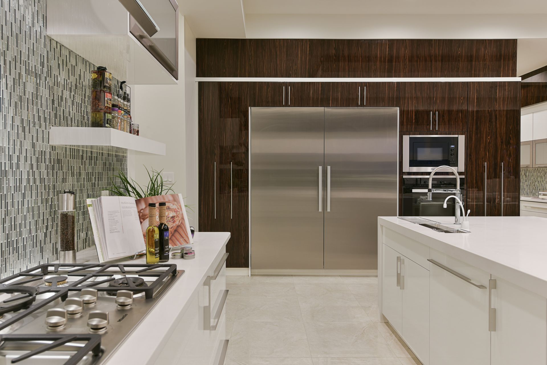 A kitchen with stainless steel appliances and white cabinets
