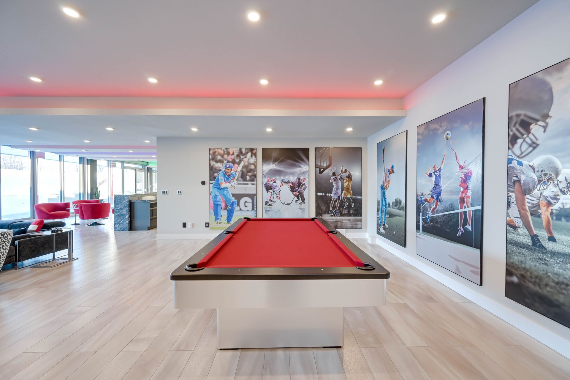 There is a pool table in the middle of the room.