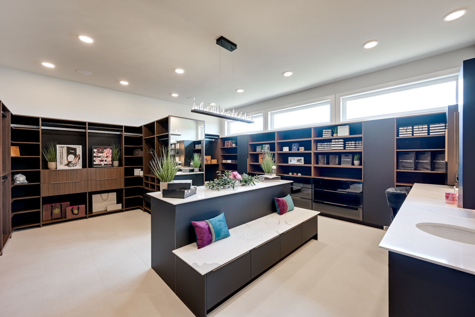 A large room with a lot of shelves and a bench.