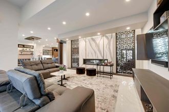 A living room filled with furniture and a fireplace.
