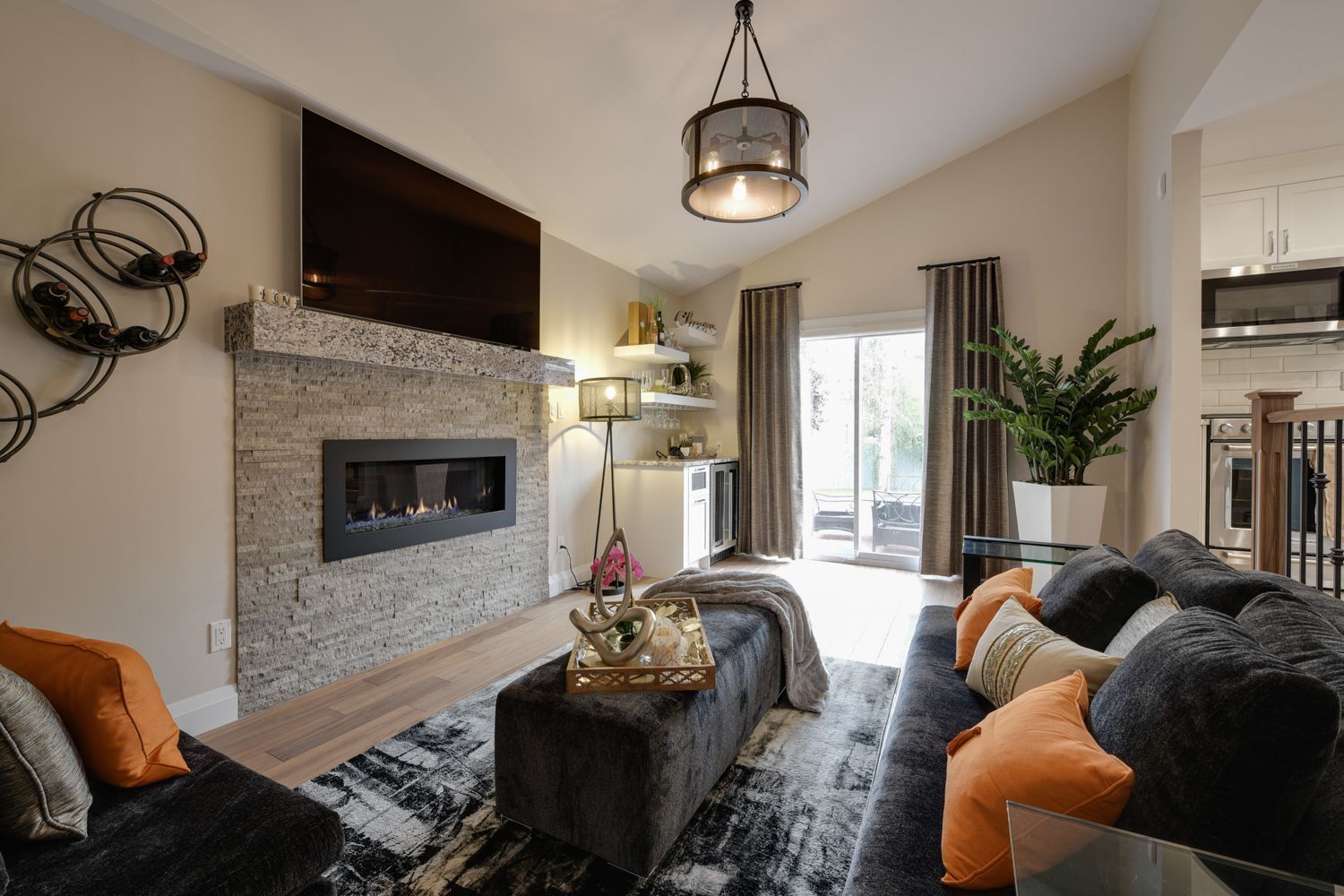 A living room with a fireplace and a flat screen tv.