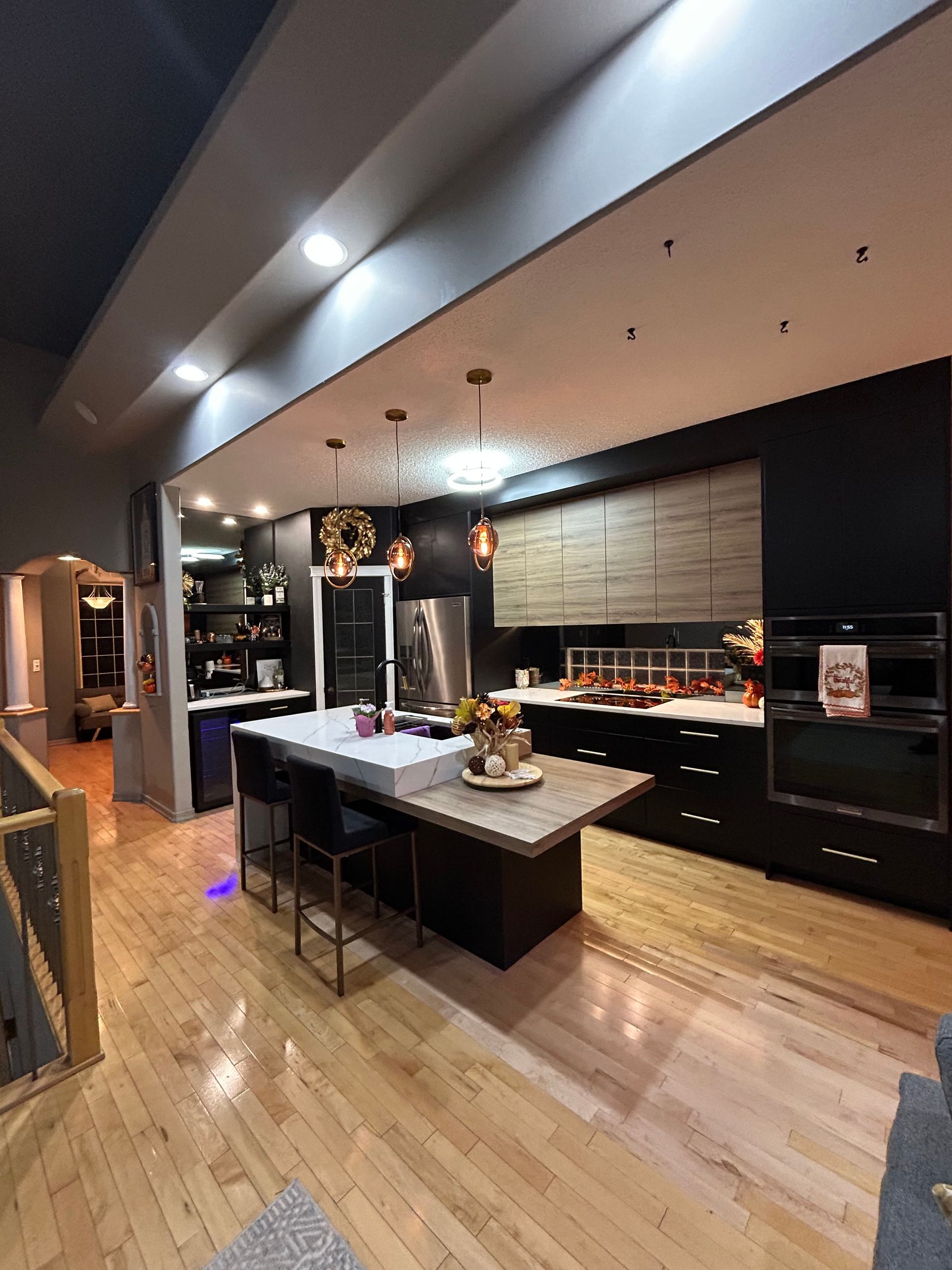 A kitchen with a large island in the middle of it