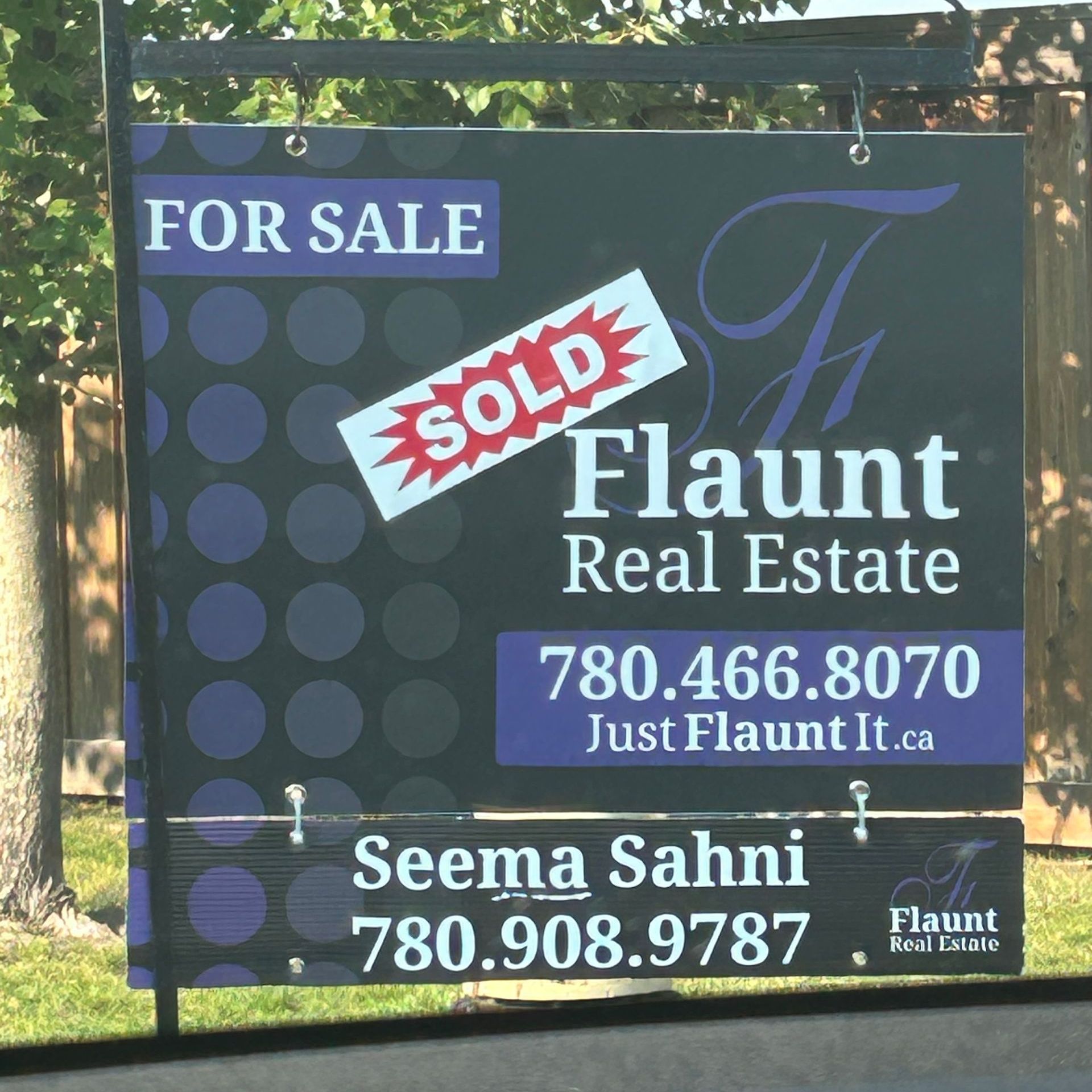 A for sale sign for flaunt real estate