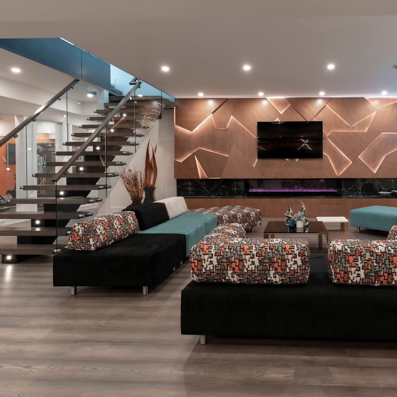 A living room filled with furniture and a staircase