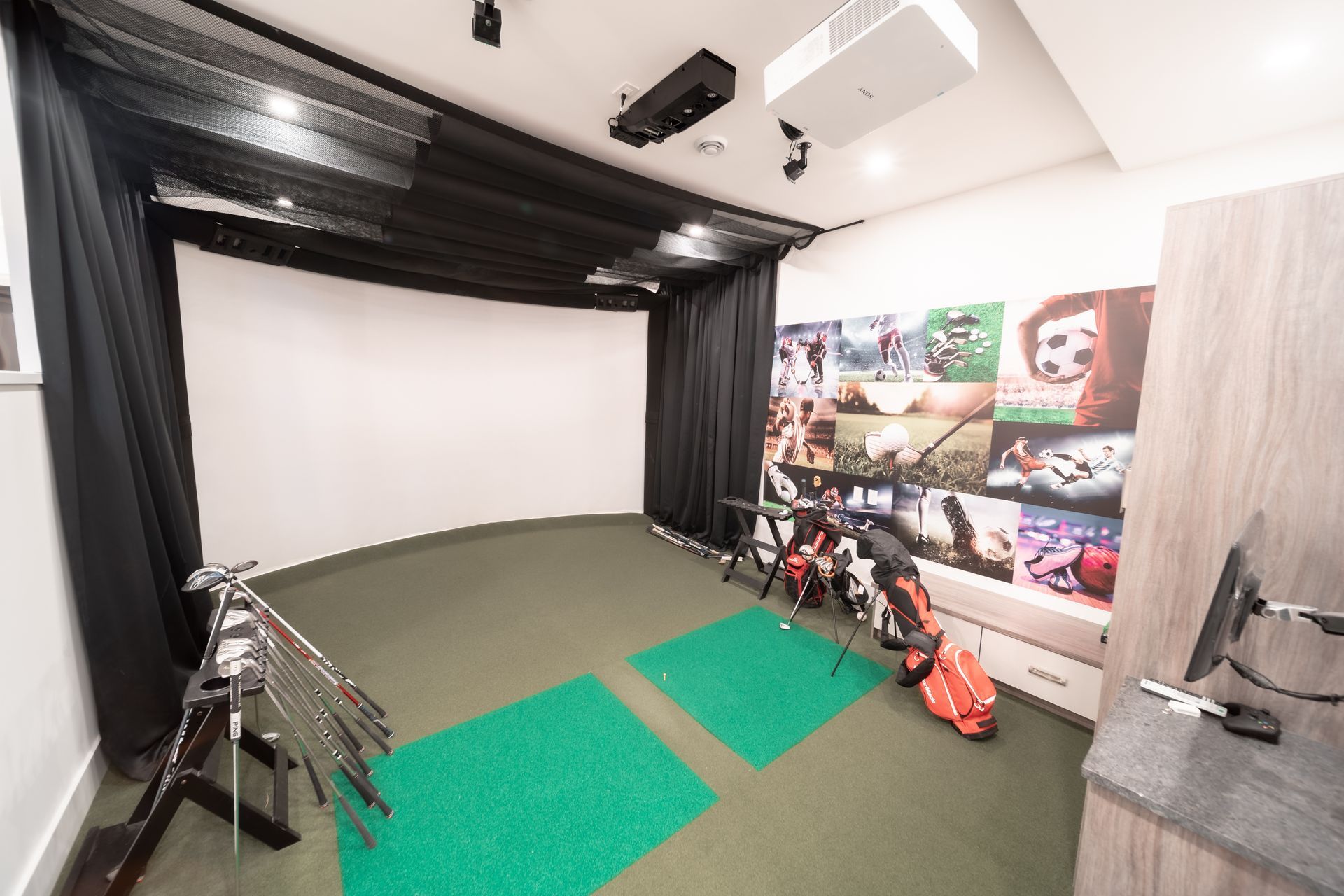 A room with a lot of golf clubs in it