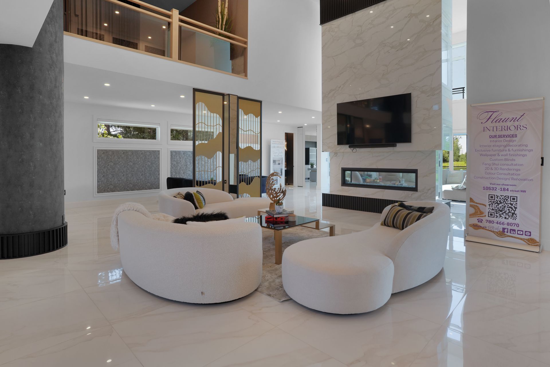 A living room with white furniture , a fireplace and a television.