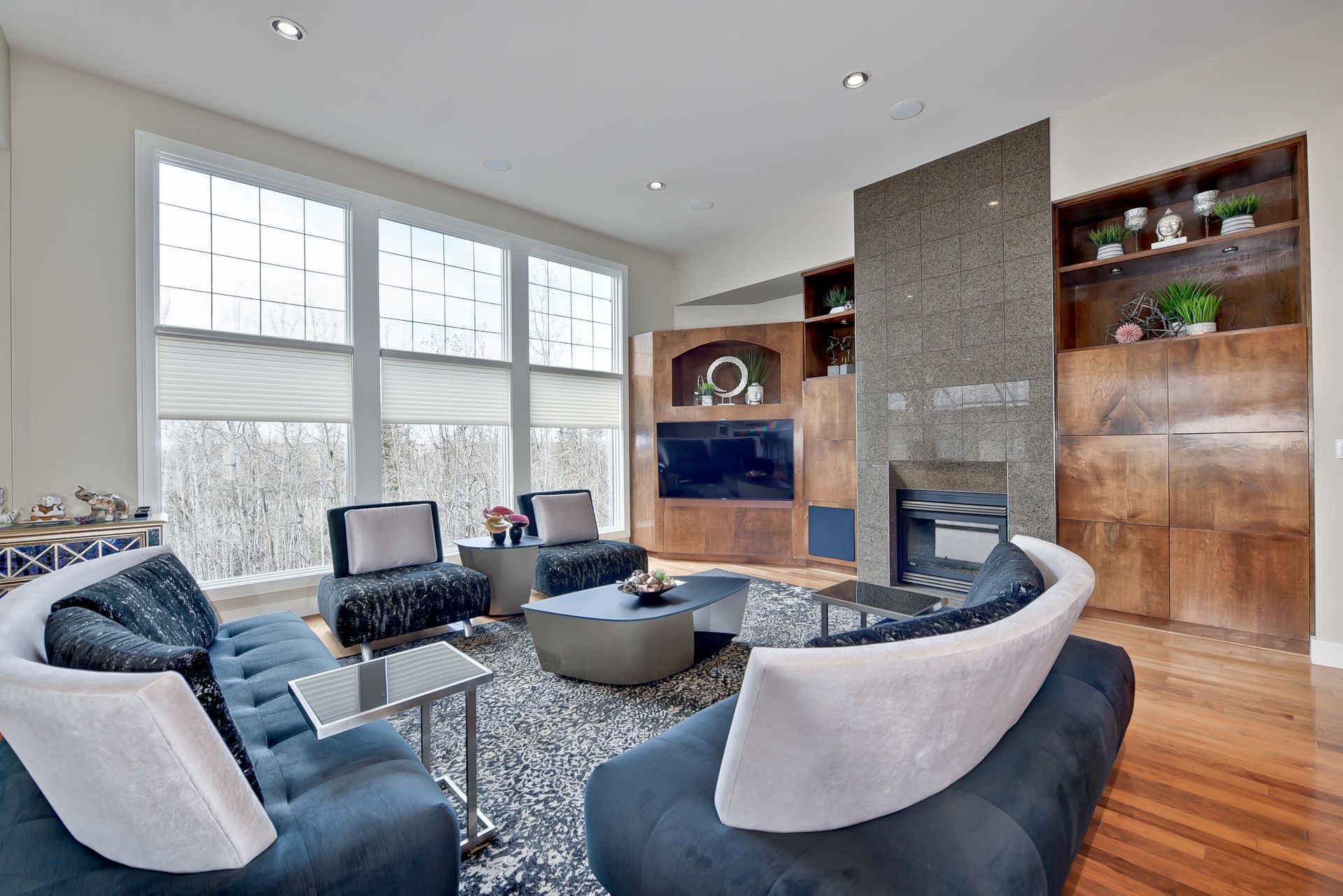 A living room with a lot of furniture and a fireplace