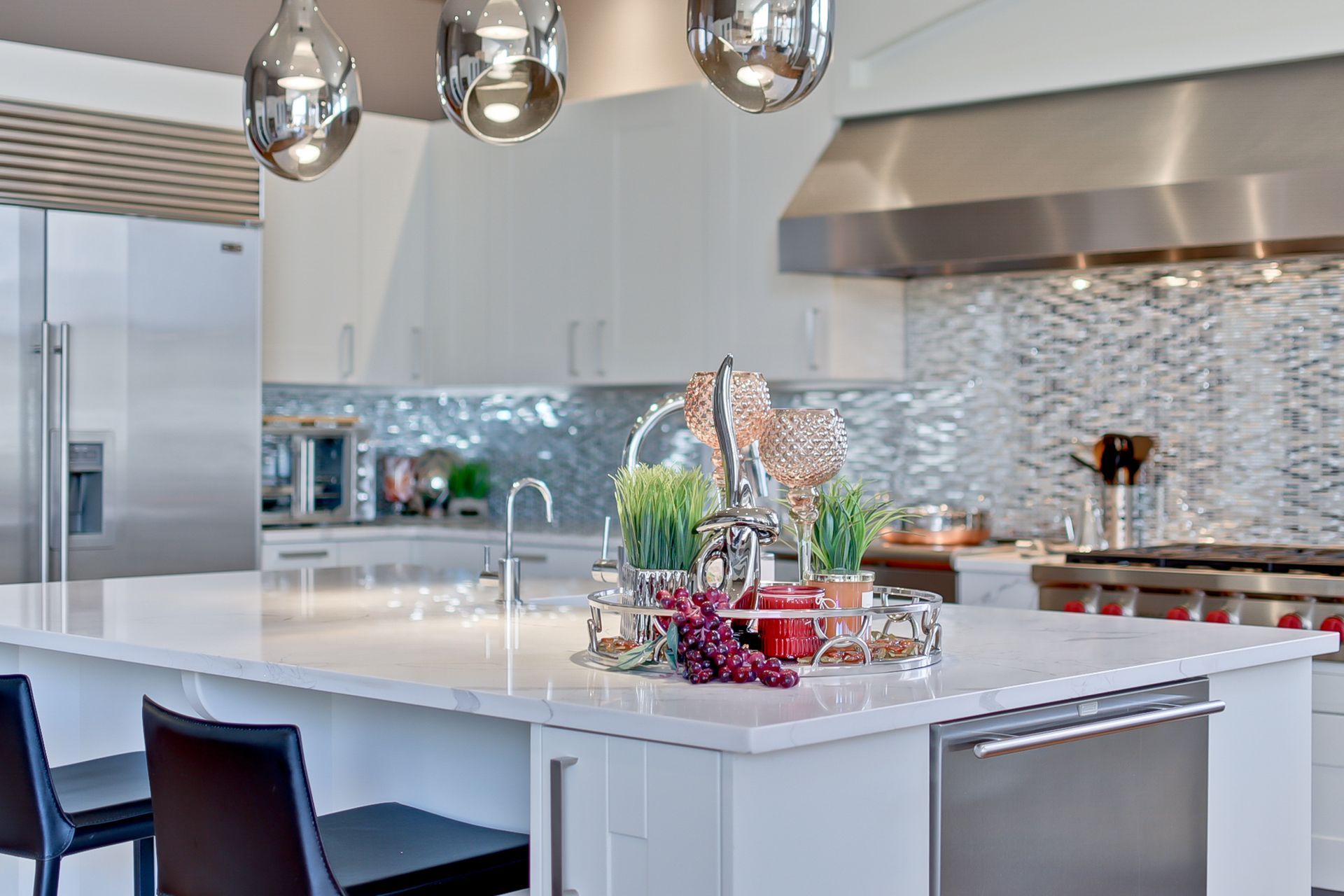 A kitchen with a large island and stainless steel appliances