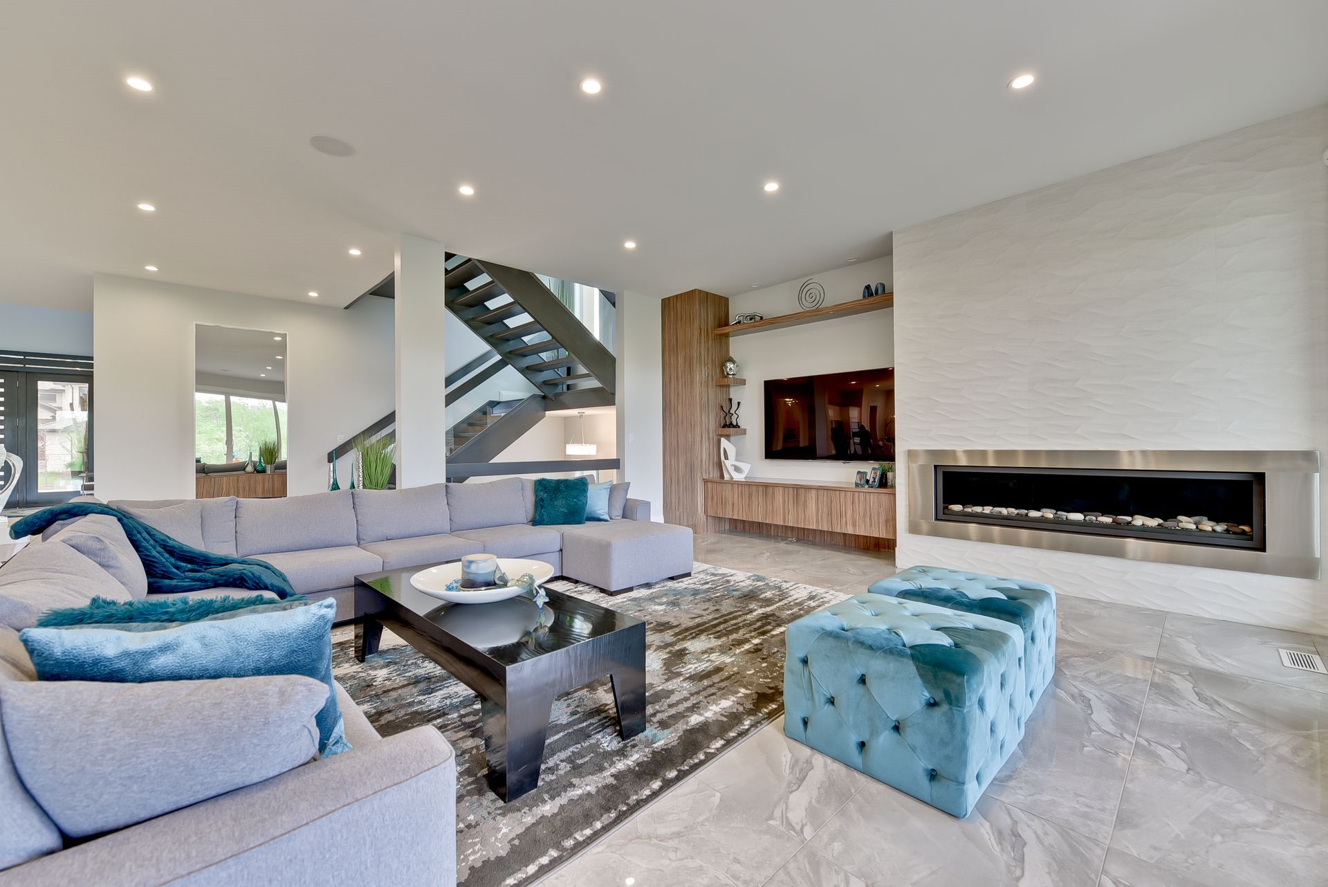 A living room filled with furniture and a fireplace.