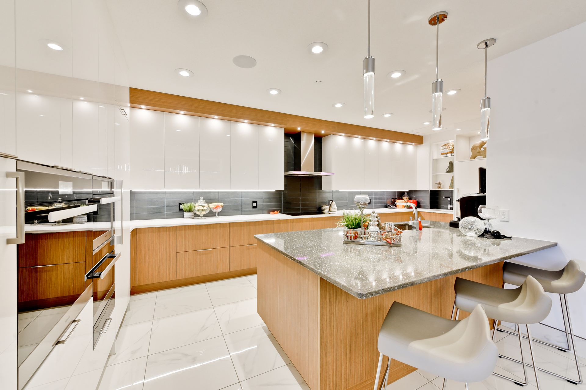 A kitchen with a large island in the middle of it.