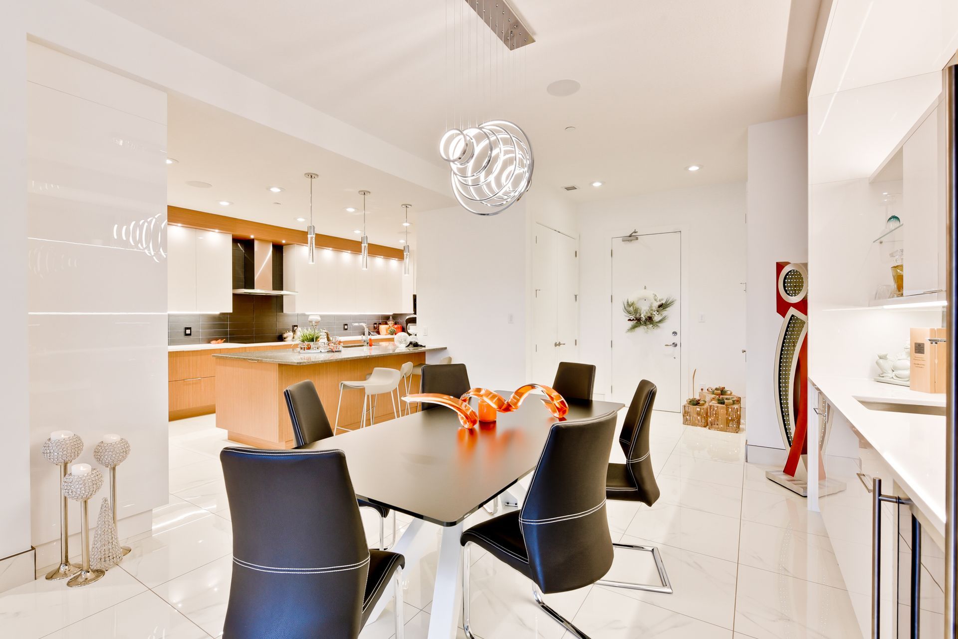 A dining room with a table and chairs in it