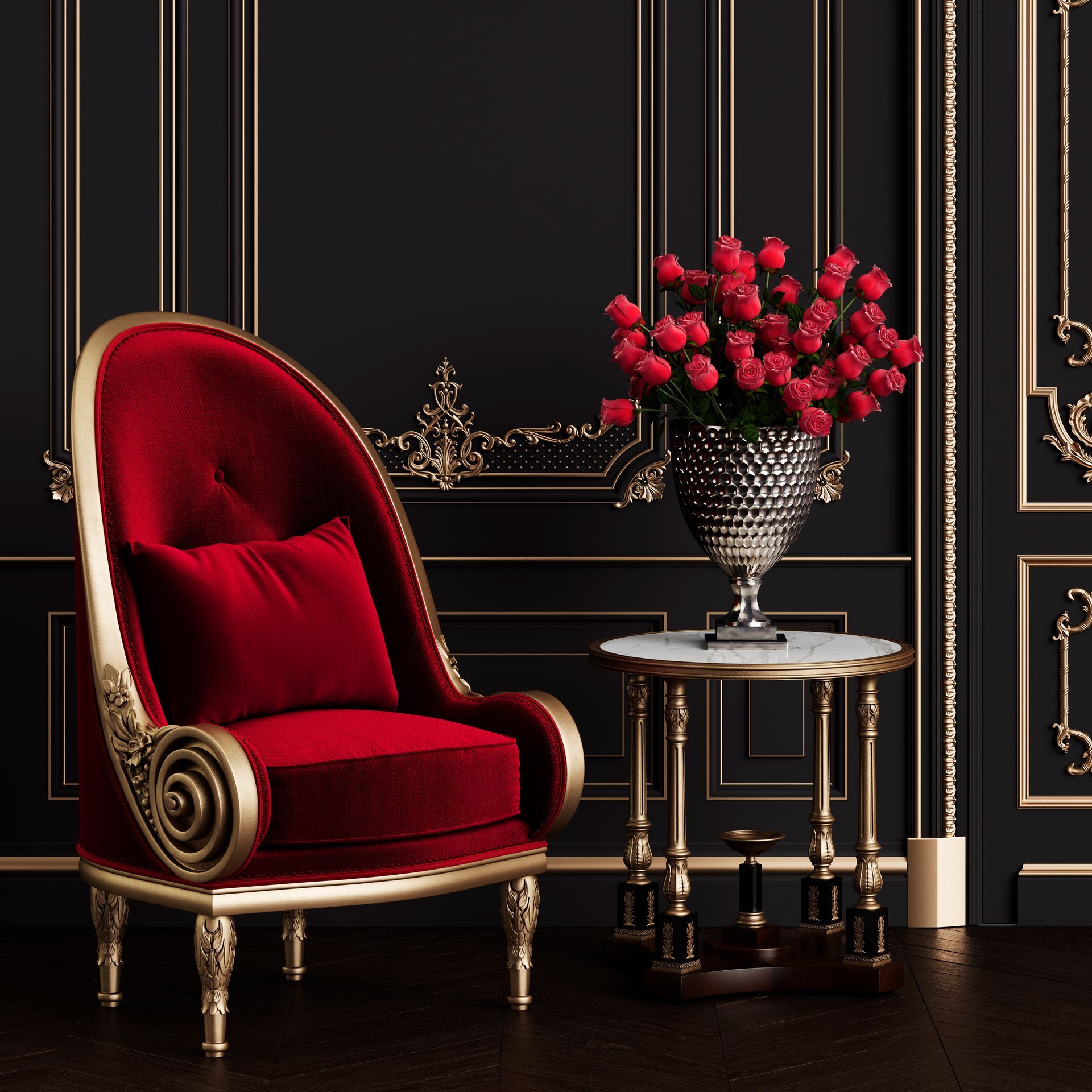A red chair is sitting next to a table with a vase of flowers on it.