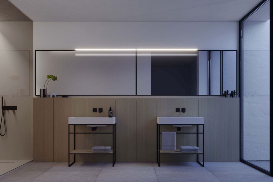 Un bagno con due lavandini e un grande specchio