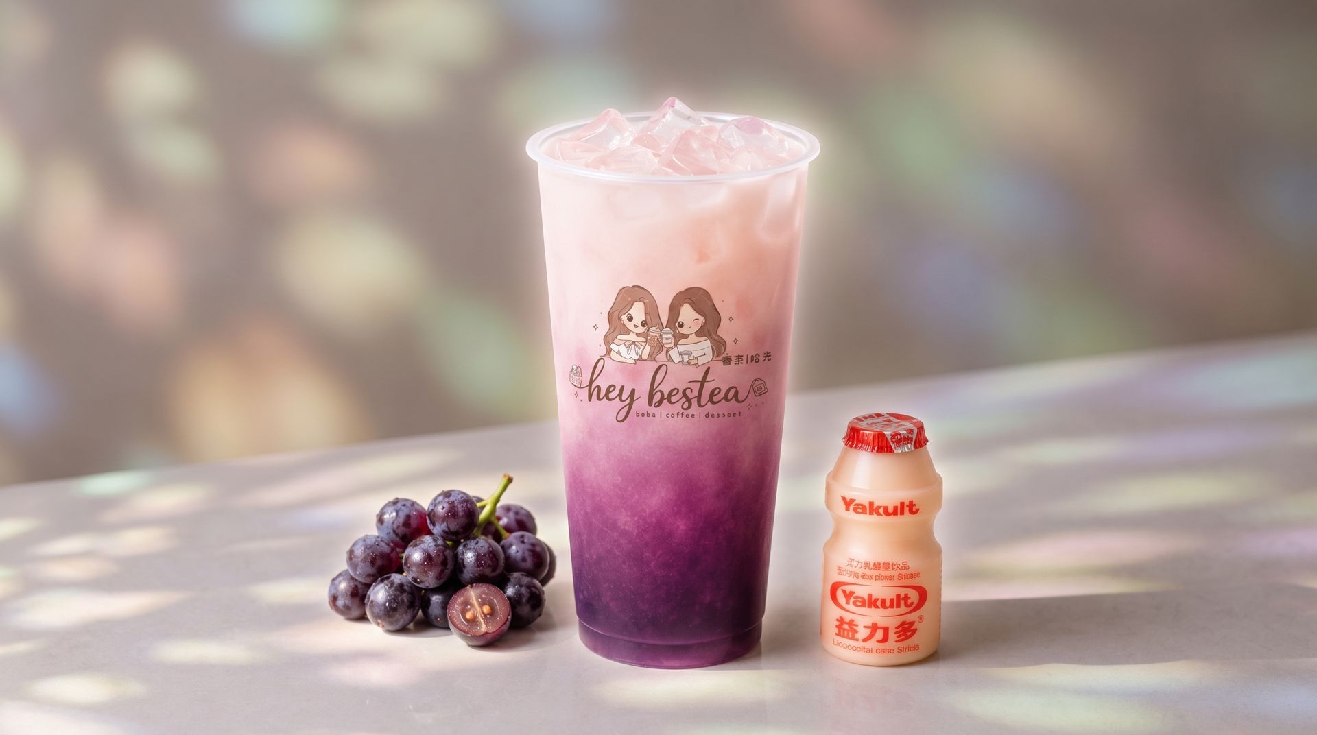 Purple berry smoothie with whipped cream beside fresh blackberries and a small cream bottle