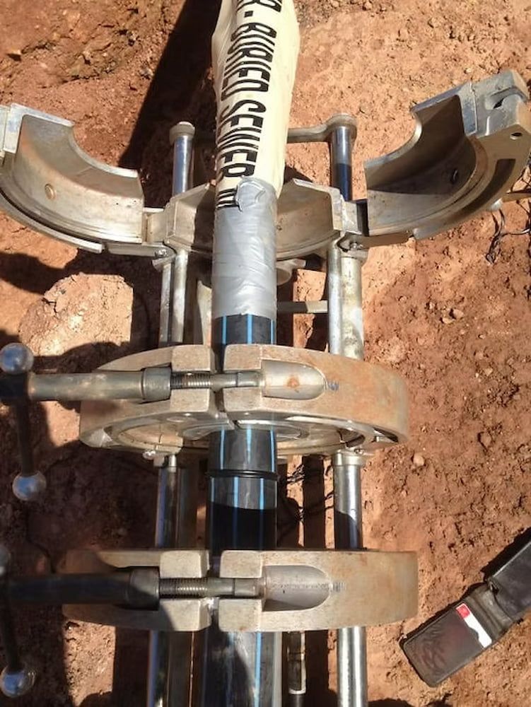 A Pipe is Being Drilled Into the Ground With a Machine — Ausplumb NT in Palmerston, NT