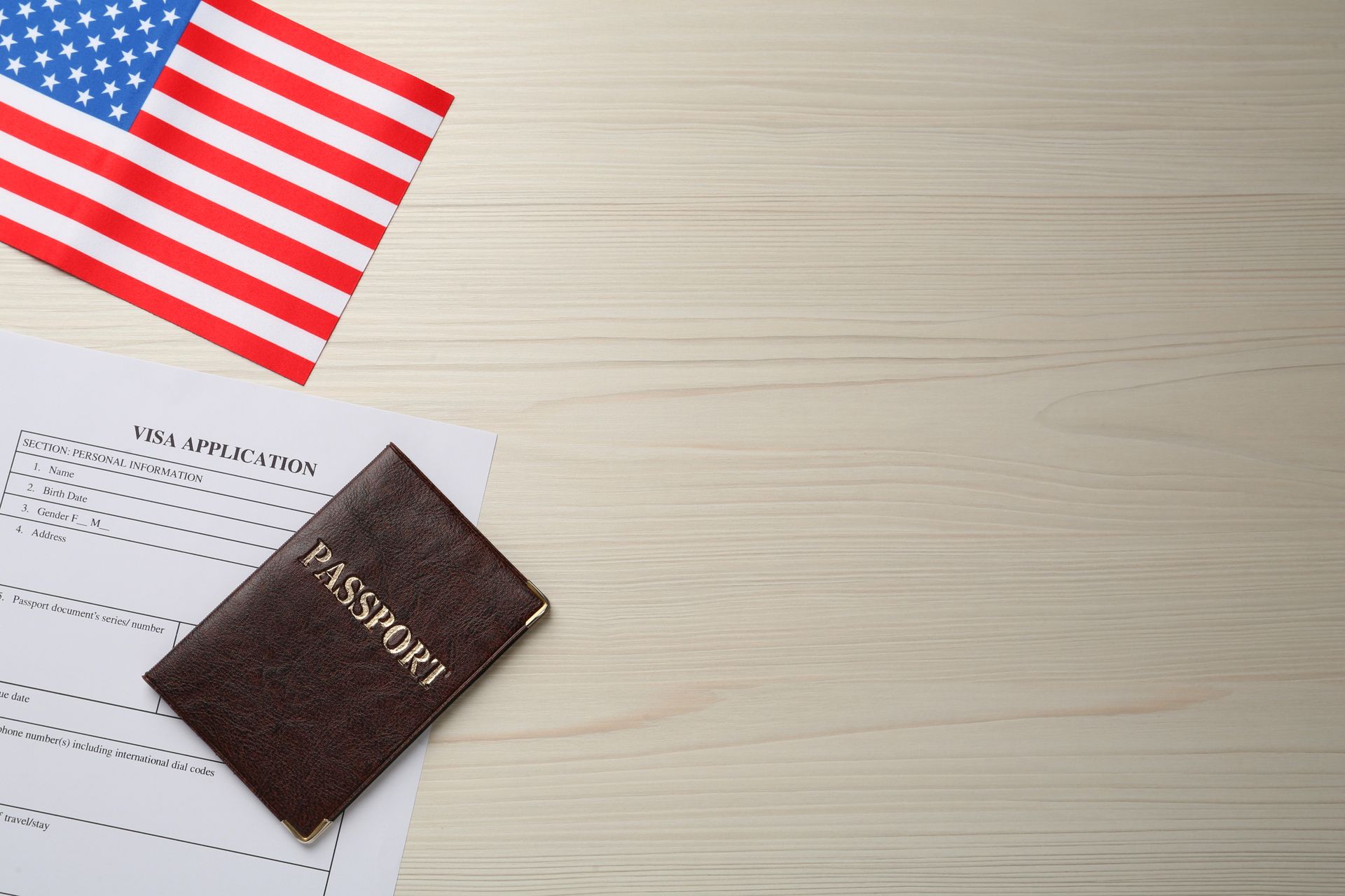 American flag, passport, and application representing naturalization attorney in Florida.