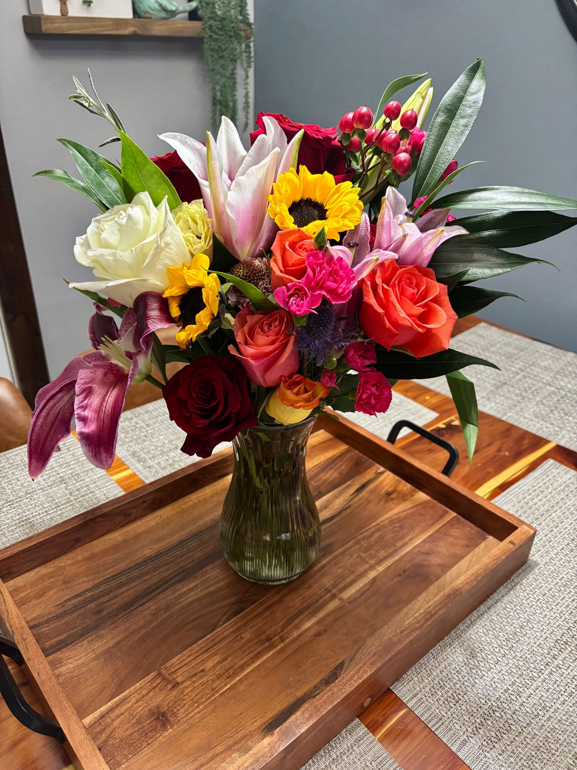 bouquet with sunflowers, roses, and lilies