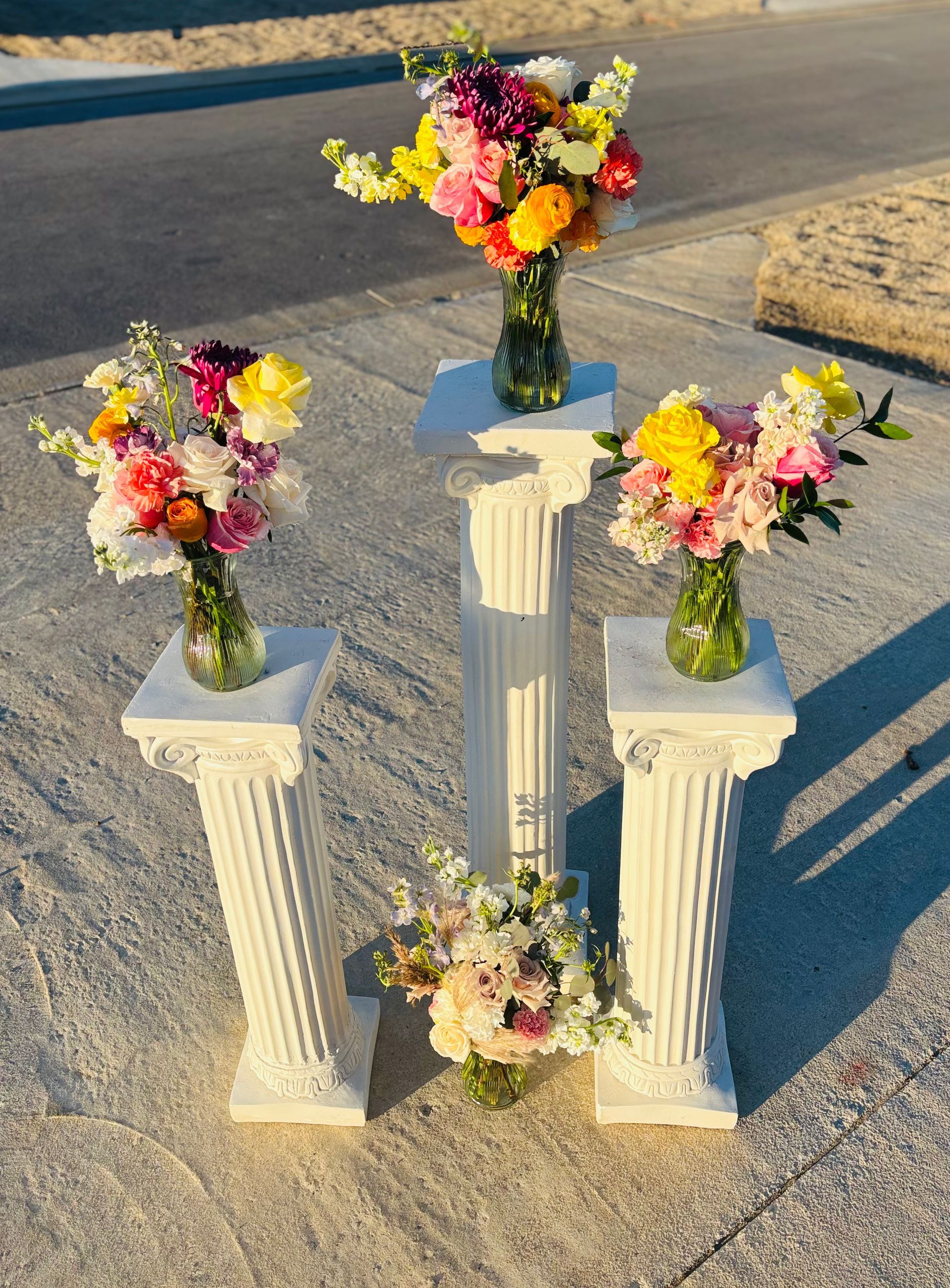 colorful bouquets on white columns