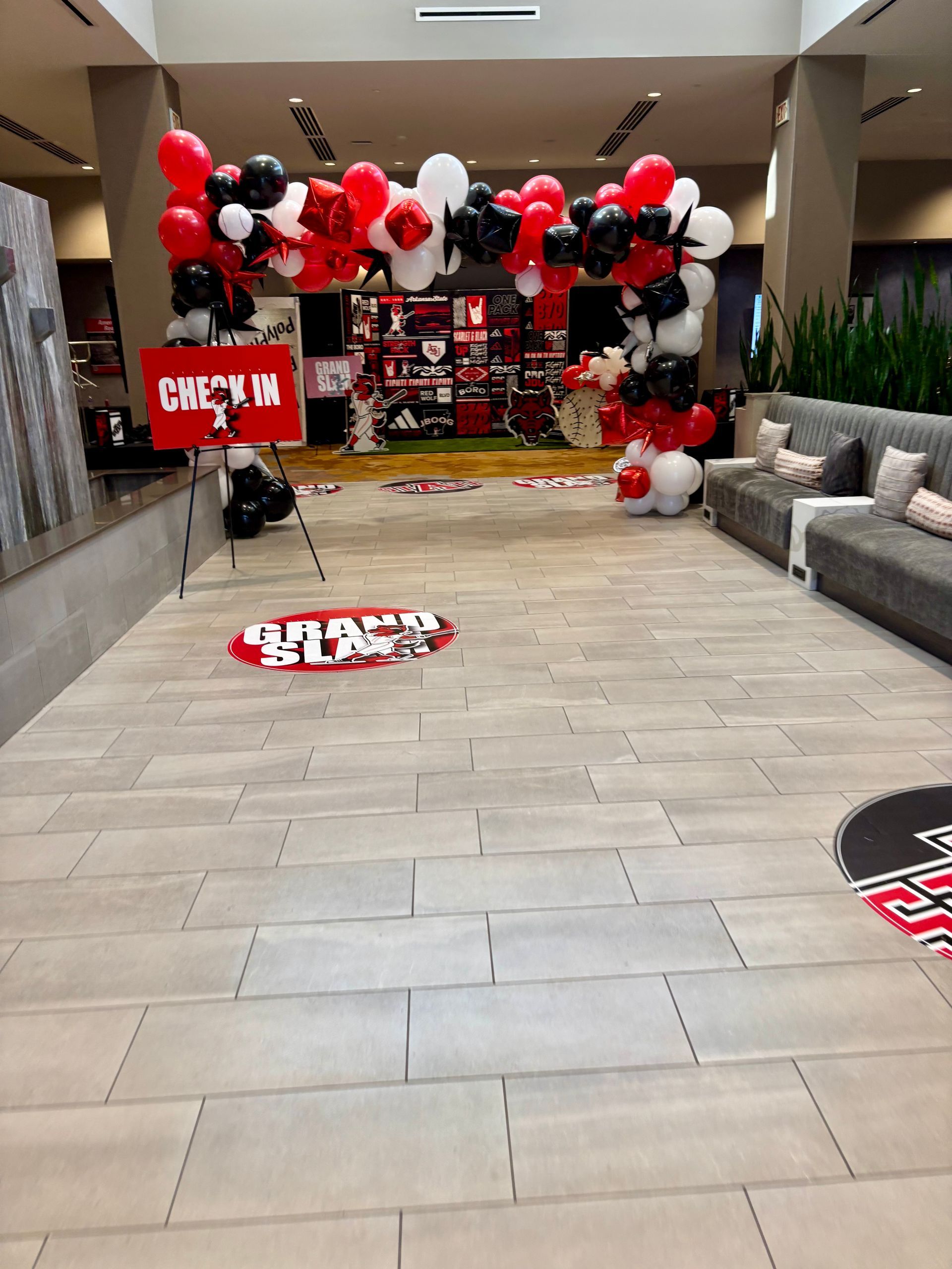 large red, white, and black balloon arch